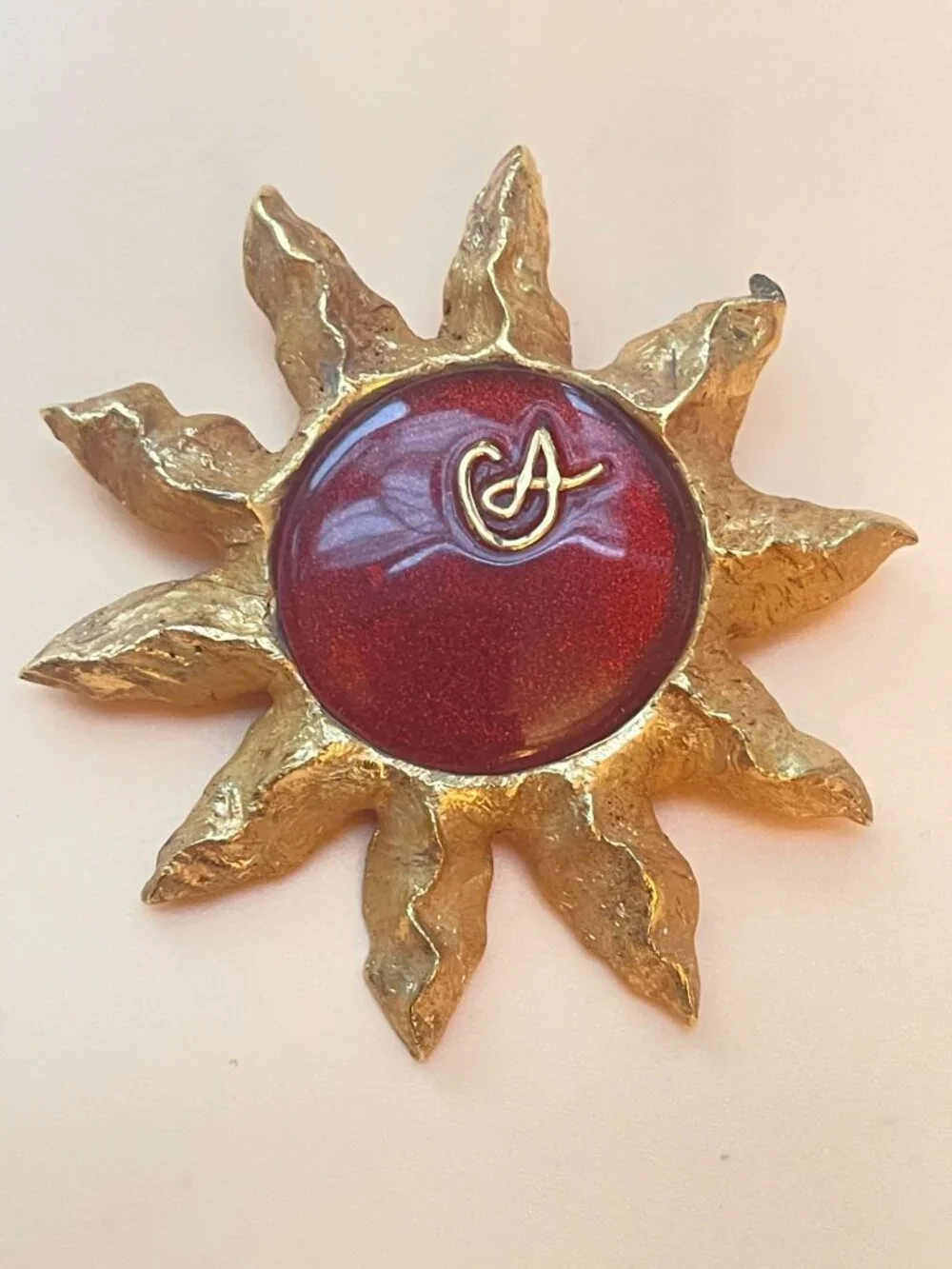 Christian Lacroix Gold-Tone Sun Brooch W/ Red Resin Center & Golden Logo